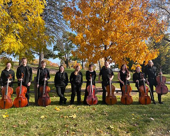 Benjamin Whitcomb and a group of Cellists